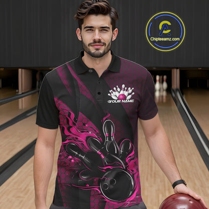 Male model at a bowling lane wearing a black and pink bowling polo shirt with bowling strike artwork, geometric accents, and diagonal striping.