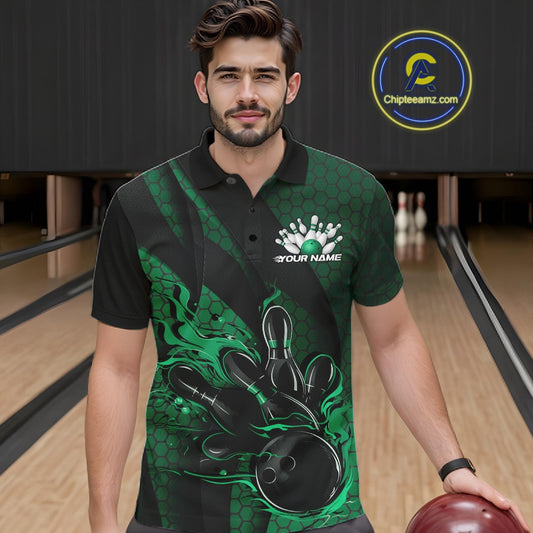 Male model wearing a black and green bowling polo shirt at a bowling lane with fiery bowling artwork, geometric patterns, and diagonal striping.