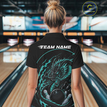 Load image into Gallery viewer, Back view of a female model in a bowling alley wearing a blue custom quarter-zip bowling shirt featuring an aggressive dragon with flames in a dynamic and energetic design.