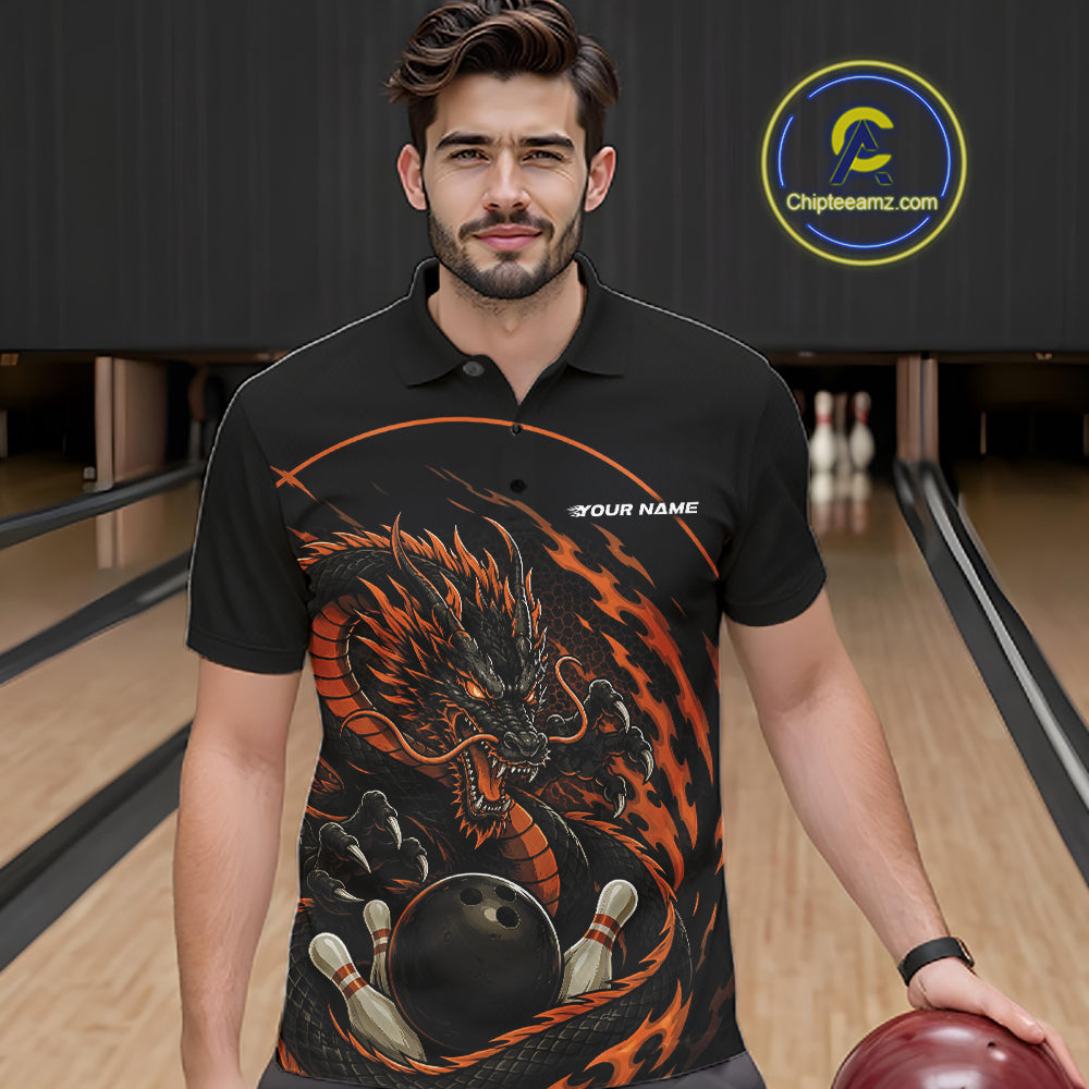 Front view of a male model in a bowling alley wearing an orange custom bowling polo shirt featuring an aggressive dragon with flames in a dynamic and energetic design.