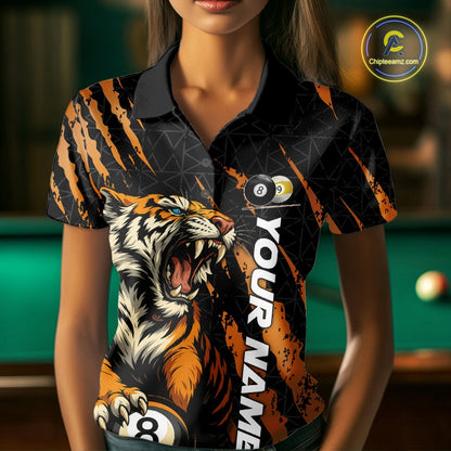 Female model front view wearing a Billiard polo shirt with roaring tiger graphics, orange claw marks, and billiard balls.