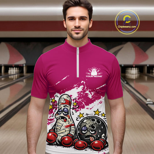 Male model at a bowling lane wearing a pink and white quarter-zip shirt, playful boxing bowling ball and pin artwork with fun sports vibe.