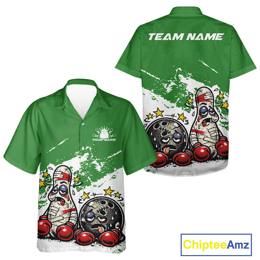 Front and back view of a button-up bowling shirt mockup in green and white, featuring cartoon boxing-style bowling ball and pin illustrated as beaten-up boxers.