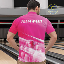 Load image into Gallery viewer, Front view of a male model at the bowling lane wearing a pink quarter zip shirt with bowling ball and pins in a geometric pattern.