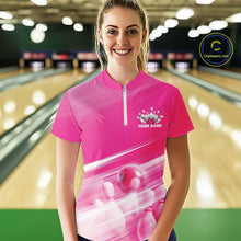 Load image into Gallery viewer, Front view of a female model at the bowling lane wearing a pink quarter zip shirt with bowling ball and pins geometric graphics.