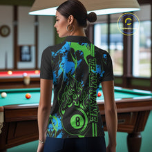 Load image into Gallery viewer, Back view of a female model wearing a polo shirt with flaming billiard 8 ball artwork on a blue and green abstract background.