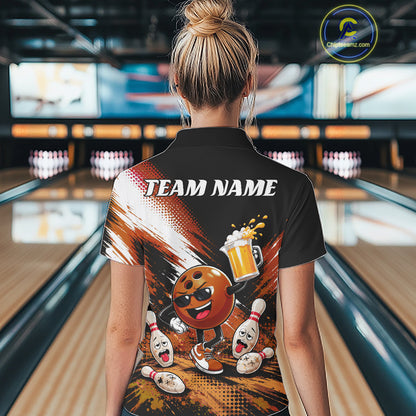 A woman viewed from behind wearing a black short-sleeve bowling-themed quarter zip shirt with a large colorful back graphic featuring a cartoon bowling ball, pins, and the text 'TEAM NAME'. The background shows a blurred bowling alley interior.