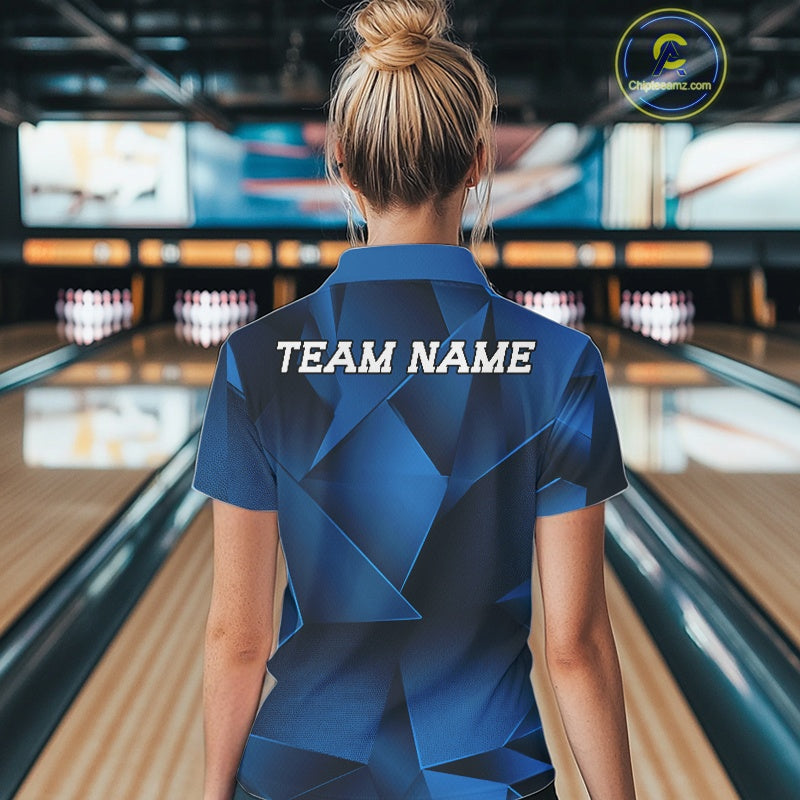 Person wearing a blue bowling shirt with 'TEAM NAME' on the back in a bowling alley.