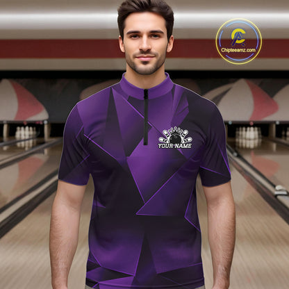 Man wearing a purple bowling shirt with a logo in a bowling alley.
