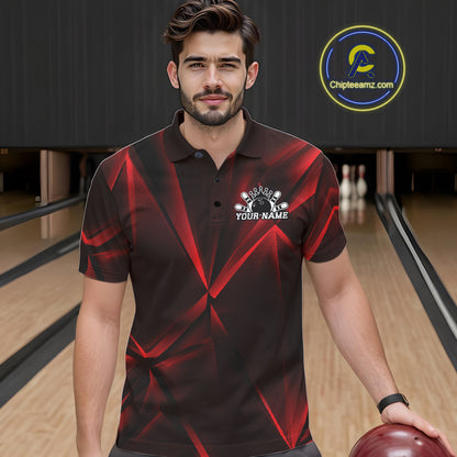 Man wearing a red and black bowling shirt with a logo in a bowling alley.