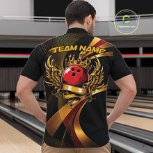 Load image into Gallery viewer, Person wearing a black bowling shirt with a red bowling ball design in a bowling alley.