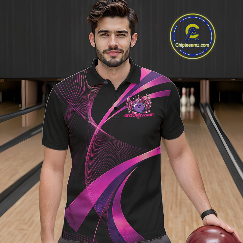 Man wearing a black and purple bowling shirt with a logo on a bowling alley.