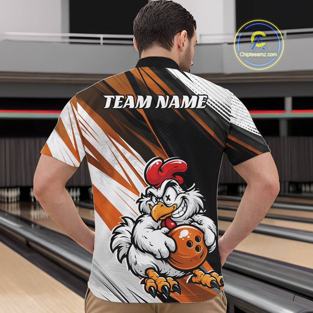 A man viewed from behind wearing a custom short-sleeve bowling jersey in a bowling alley. The back of the jersey features a black, white, and orange graphic design with a cartoon rooster holding a bowling ball and the text 'TEAM NAME'.