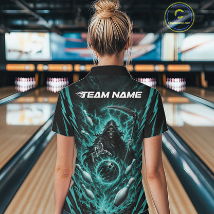 A woman viewed from behind wearing a black short-sleeve polo bowling shirt with a large teal and black grim reaper graphic and the text 'TEAM NAME' across the upper back, standing in a bowling alley.