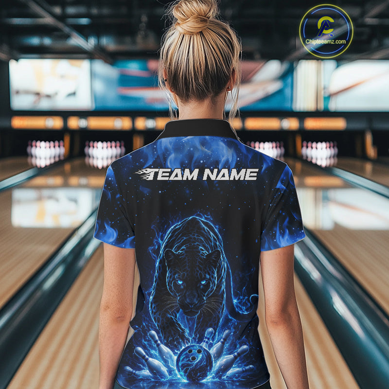Back view of a female model in a bowling lane wearing a black polo shirt featuring glowing blue electric panther and energetic bowling action graphics.