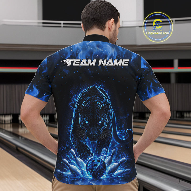 Front view of a male model in a bowling lane wearing a black quarter-zip shirt featuring glowing blue electric panther artwork with dynamic bowling action scene.