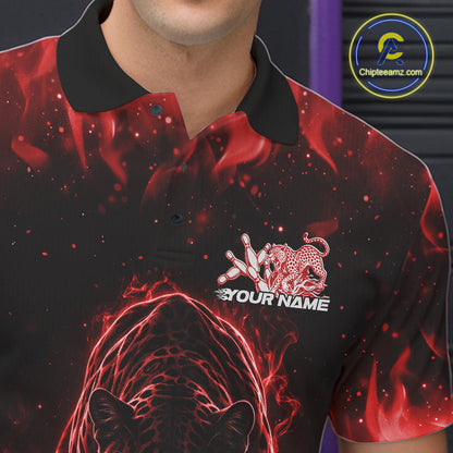 Close-up view of the left chest of a black bowling polo shirt featuring a glowing red electric panther with bowling ball crashing through pins dynamic detail.