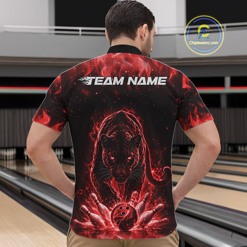 Front view of a male model in a bowling lane wearing a black quarter-zip shirt featuring glowing red electric panther design with powerful bowling action scene.