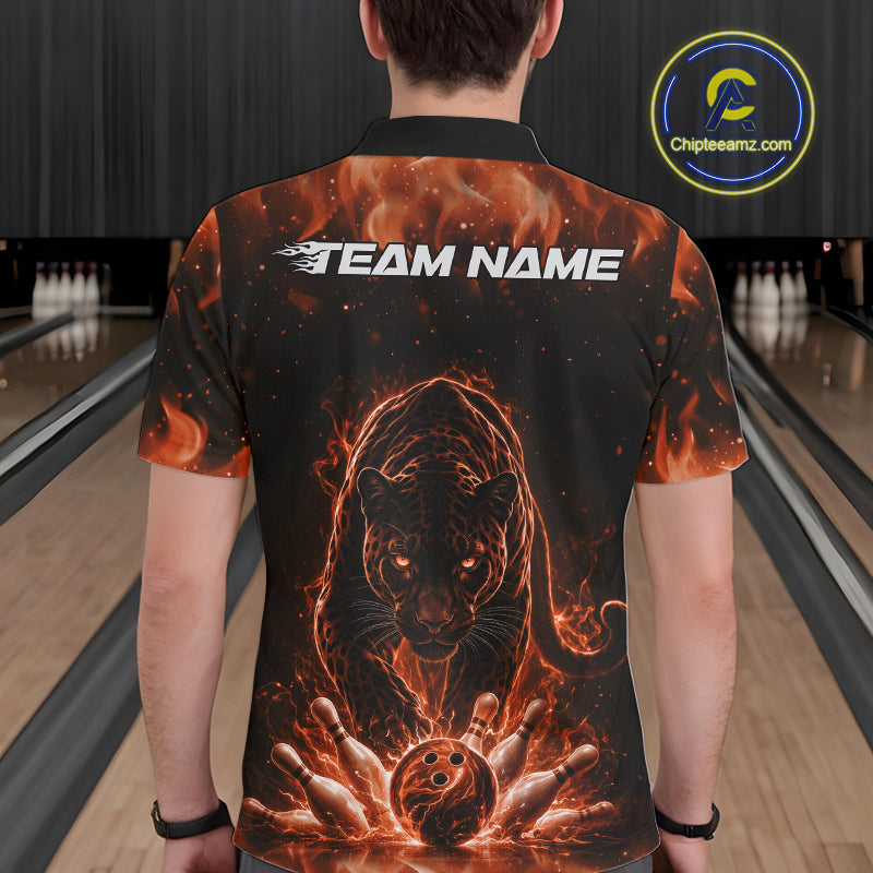 Back view of a male model in a bowling lane wearing a black polo shirt featuring glowing orange electric panther design with bowling strike action artwork.