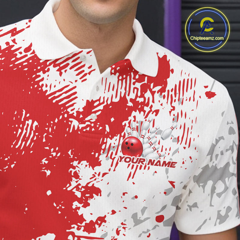 Close-up view of the left chest of a red and white splatter bowling polo shirt showing minimalist sporty bowling design detail.