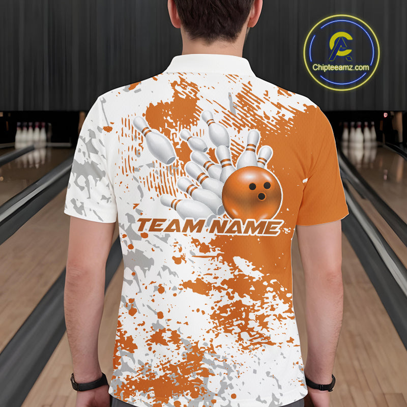 Back view of a male model in a bowling lane wearing an orange and white splatter bowling polo shirt with clean sporty bowling-inspired graphics.