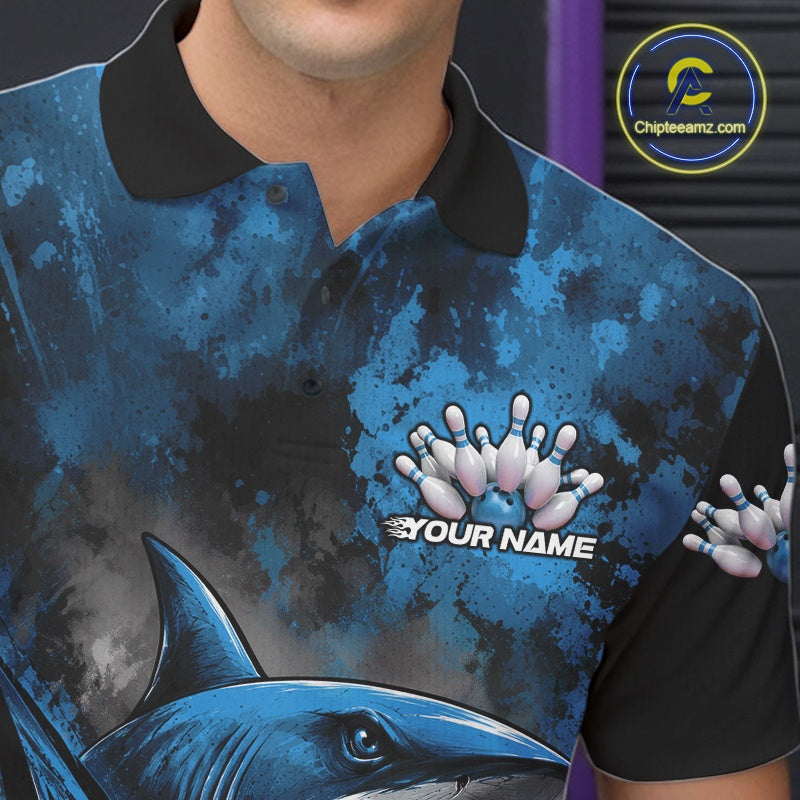 Blue and black polo shirt with shark design and 'Your Name' text, brand logo visible.