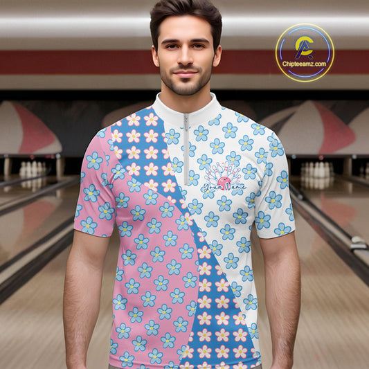Male model in a bowling lane wearing a quarter zip shirt, front view featuring white, blue, and pink floral pattern with soft artistic styling