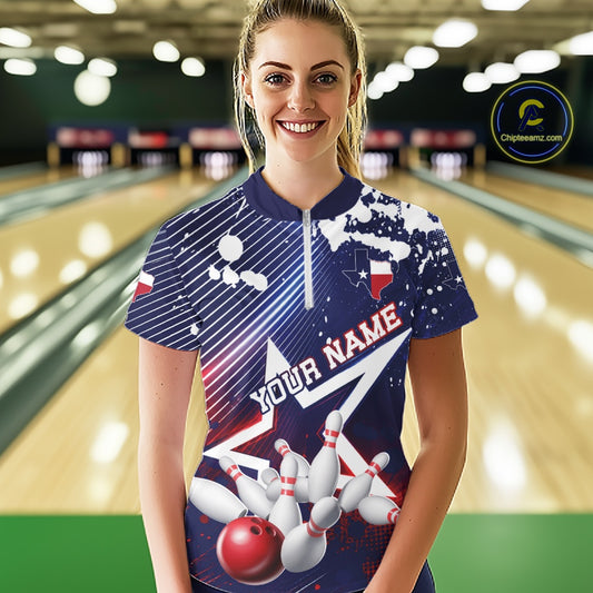 A woman wearing a custom bowling-themed short-sleeve shirt with a bowling pin and ball graphic, set against a blurred bowling alley background.