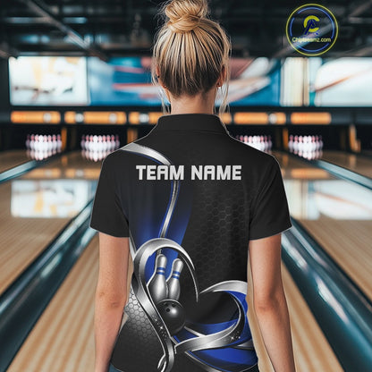 Back view of a female model in a bowling center wearing a black and blue quarter zip shirt with honeycomb graphics and heart-framed bowling action scene.
