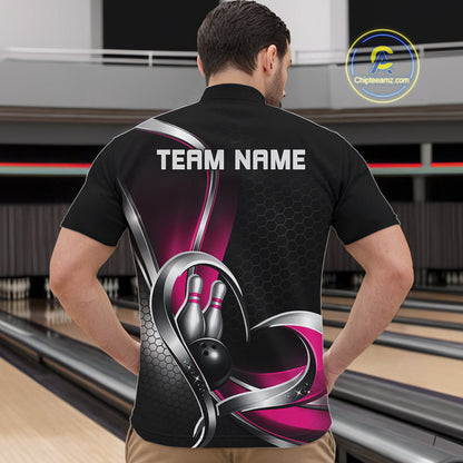Male model at a bowling alley wearing a black and pink quarter zip shirt, featuring honeycomb pattern and a heart-shaped bowling action illustration.