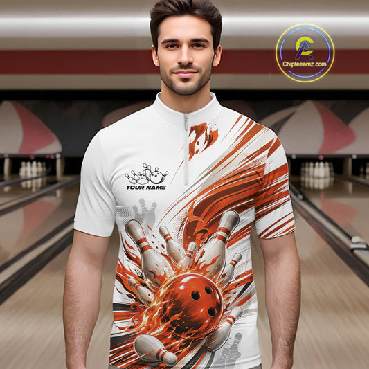 A man wearing a white short-sleeve bowling-themed graphic quarter-zip shirt with orange and gray flame/spark effects, standing in a bowling alley. The shirt features a mock neck, a half-zip collar, and a graphic of bowling pins and a bowling ball exploding into flames.