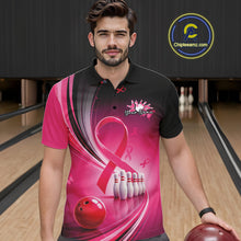 Load image into Gallery viewer, Front view of a male model wearing a black and pink bowling polo with breast cancer awareness ribbon graphics and bowling artwork