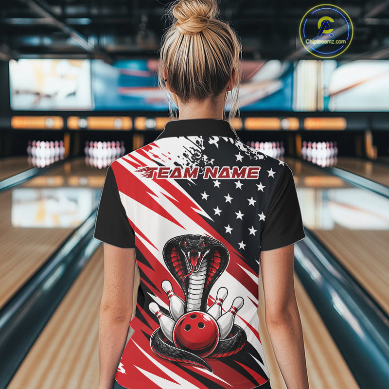 Back view of a woman in a bowling alley wearing a black, white, and red american flag cobra-themed shirt with “Team Name” across the shoulders.