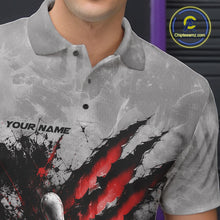 Load image into Gallery viewer, Close-up view of the left chest of a gray bowling polo shirt featuring a dramatic red bowling ball and pins graphic with claw-mark artwork.