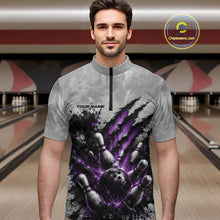 Load image into Gallery viewer, Front view of a male model wearing a gray bowling quarter zip shirt with a dramatic purple bowling ball and pins graphic accented by claw-mark artwork in a bowling lane.
