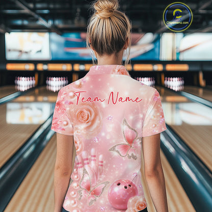Back view of a female model in a bowling alley wearing a bowling polo shirt showcasing glitter butterfly graphics, diamonds, and bowling artwork.
