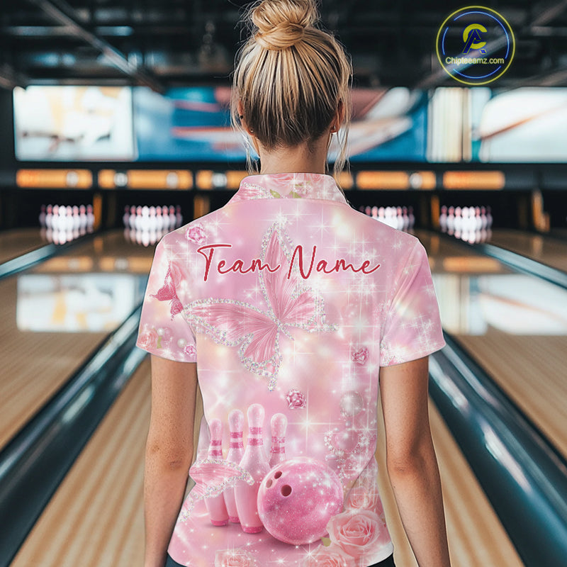 Back view of a female model wearing a bowling polo shirt featuring pink glitter butterflies, diamonds, bowling pins, and bowling-themed accents.