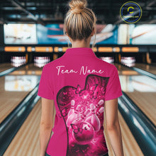 Load image into Gallery viewer, Female model in a pink bowling polo with butterfly graphics and bowling artwork, back view inside a bowling center