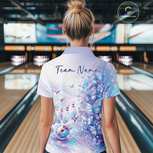 Load image into Gallery viewer, Female model in a bowling quarter zip with pastel purple and pink holographic butterfly artwork and bowling graphics, back view inside a bowling alley