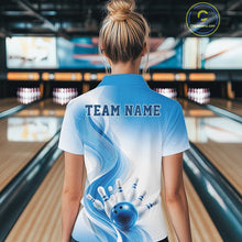 Load image into Gallery viewer, White and blue bowling polo shirt displayed from the back on a female model, showcasing flowing graphics and bowling pin imagery