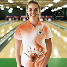 Load image into Gallery viewer, Front view of a womens white and orange bowling polo shirt featuring flowing wave graphics and a dynamic bowling action scene