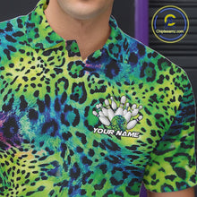 Load image into Gallery viewer, Close-up of a yellow, brown, and black leopard-print bowling shirt with a chest graphic showing pins, a patterned bowling ball, and “Your Name.”