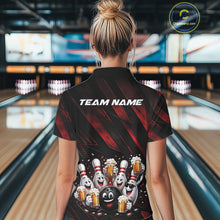 Load image into Gallery viewer, Back view of a female model wearing a black and red bowling polo shirt with festive artwork of cartoon bowling balls and pins celebrating with frothy beer mugs, confetti, and bold diagonal stripes in a bowling lane.