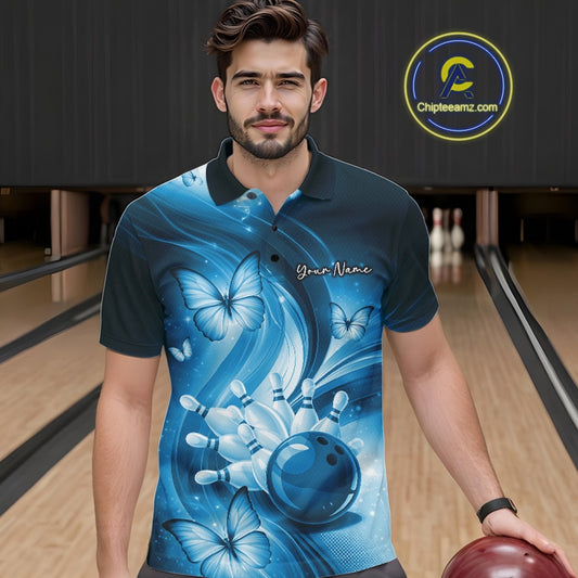 Male model wearing a blue bowling polo in a bowling alley with bowling action artwork and butterfly accents.