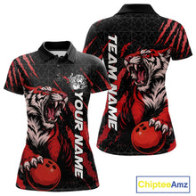 Load image into Gallery viewer, Front and back view of a black and red women's bowling polo shirt featuring a roaring tiger holding a red bowling ball with matching claw-stripe graphics and a geometric background pattern.