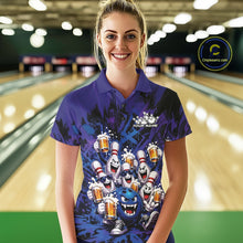 Load image into Gallery viewer, Front view of a female model at a bowling lane wearing a blue and purple bowling polo shirt decorated with playful artwork of funny bowling pins and a bowling ball holding frothy beer mugs.