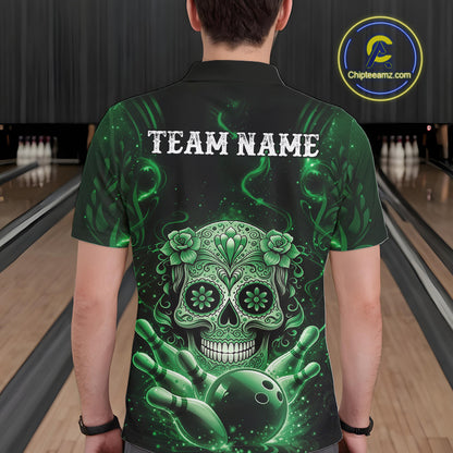 Back view of a male model in a bowling center wearing a black and green polo featuring floral sugar skull artwork and pins.