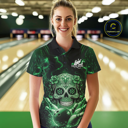 Female model wearing a black and green bowling polo shirt at a bowling lane featuring sugar skull artwork and bowling pins design.