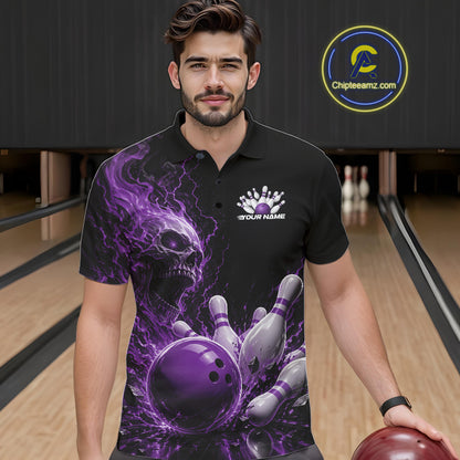 Front view of a male model in a bowling alley wearing a black bowling polo shirt featuring a purple fiery skull design with lightning striking a bowling ball and pins and a custom name.
