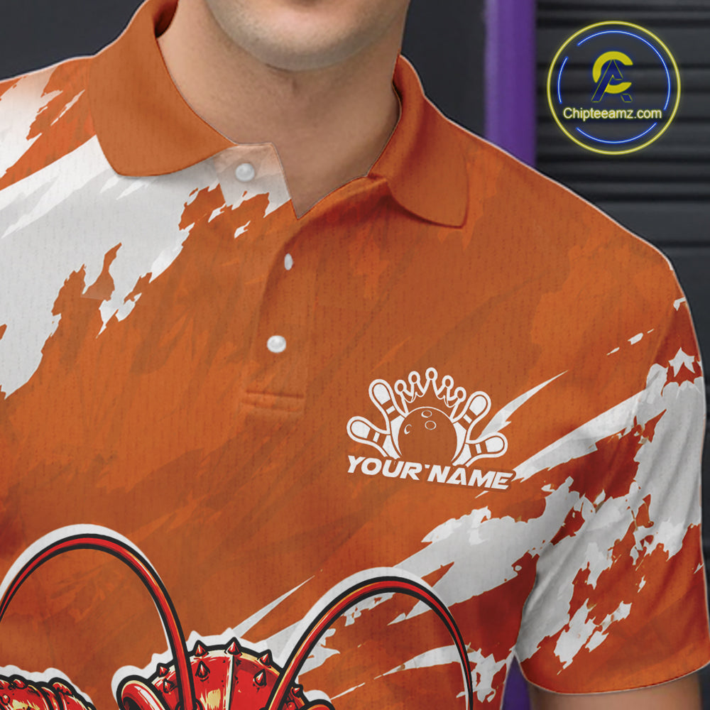 Close up front view of the left chest area on an orange custom bowling polo shirt featuring a fierce yet funny crawfish bowling character and a distressed background design.